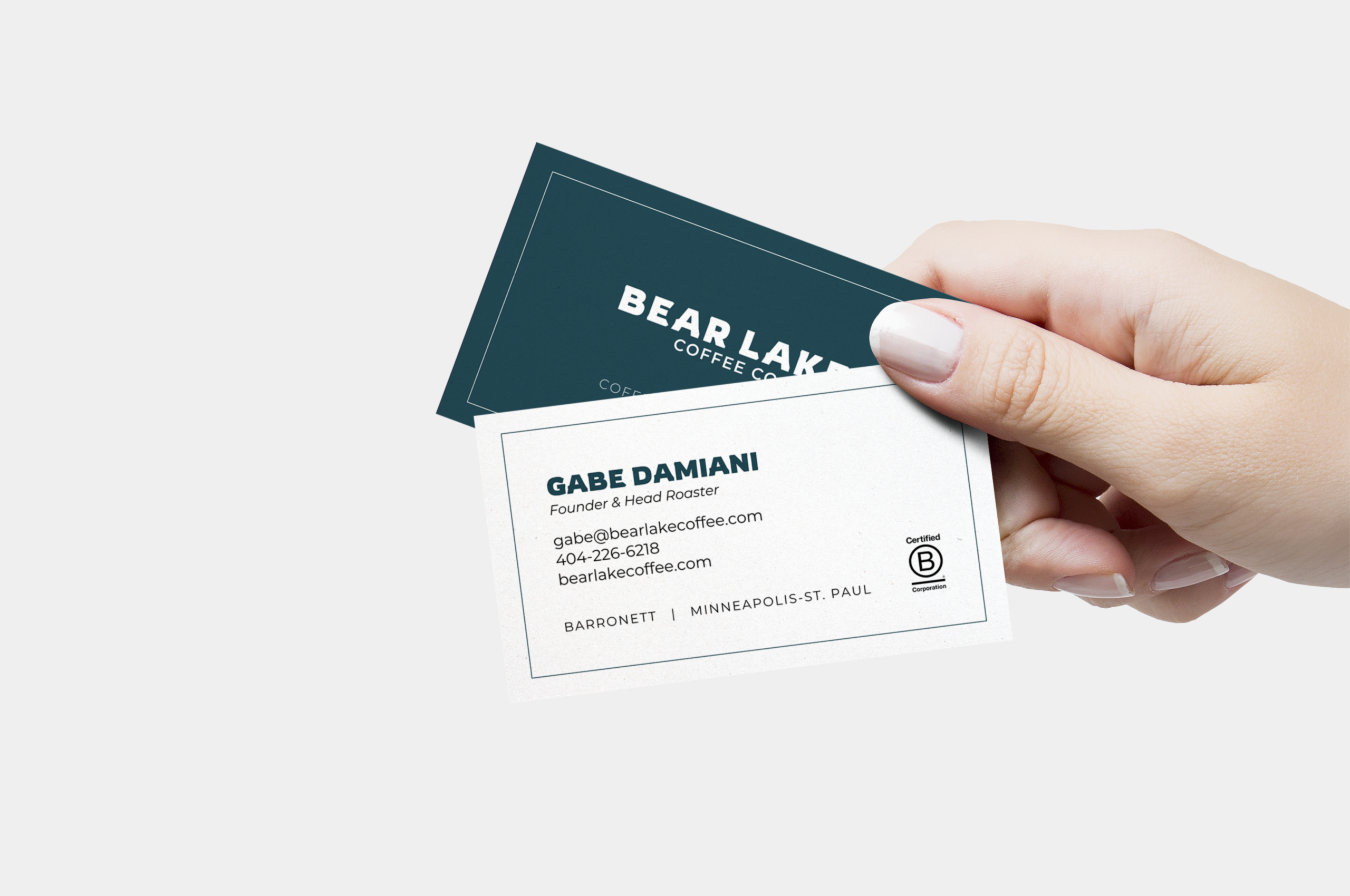 Hand holding Bear Lake Coffee business cards