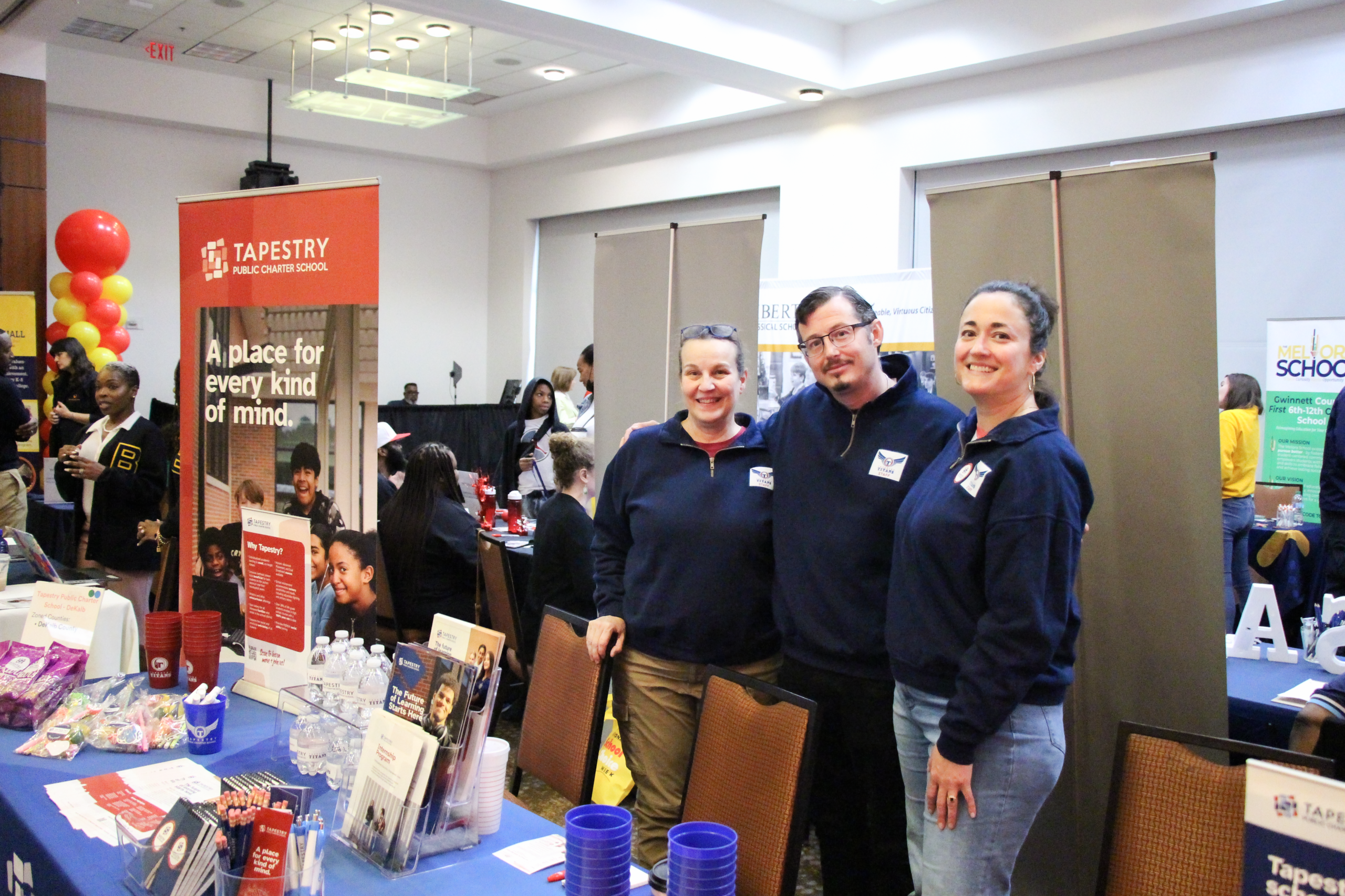 Staff at Tapestry Public Charter School information booth