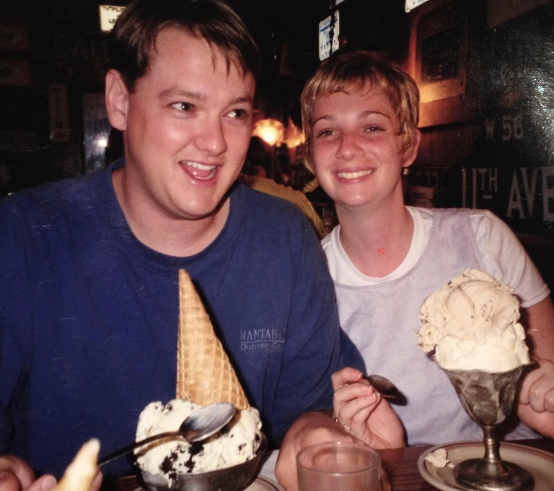 Man and woman smiling with ice cream desserts