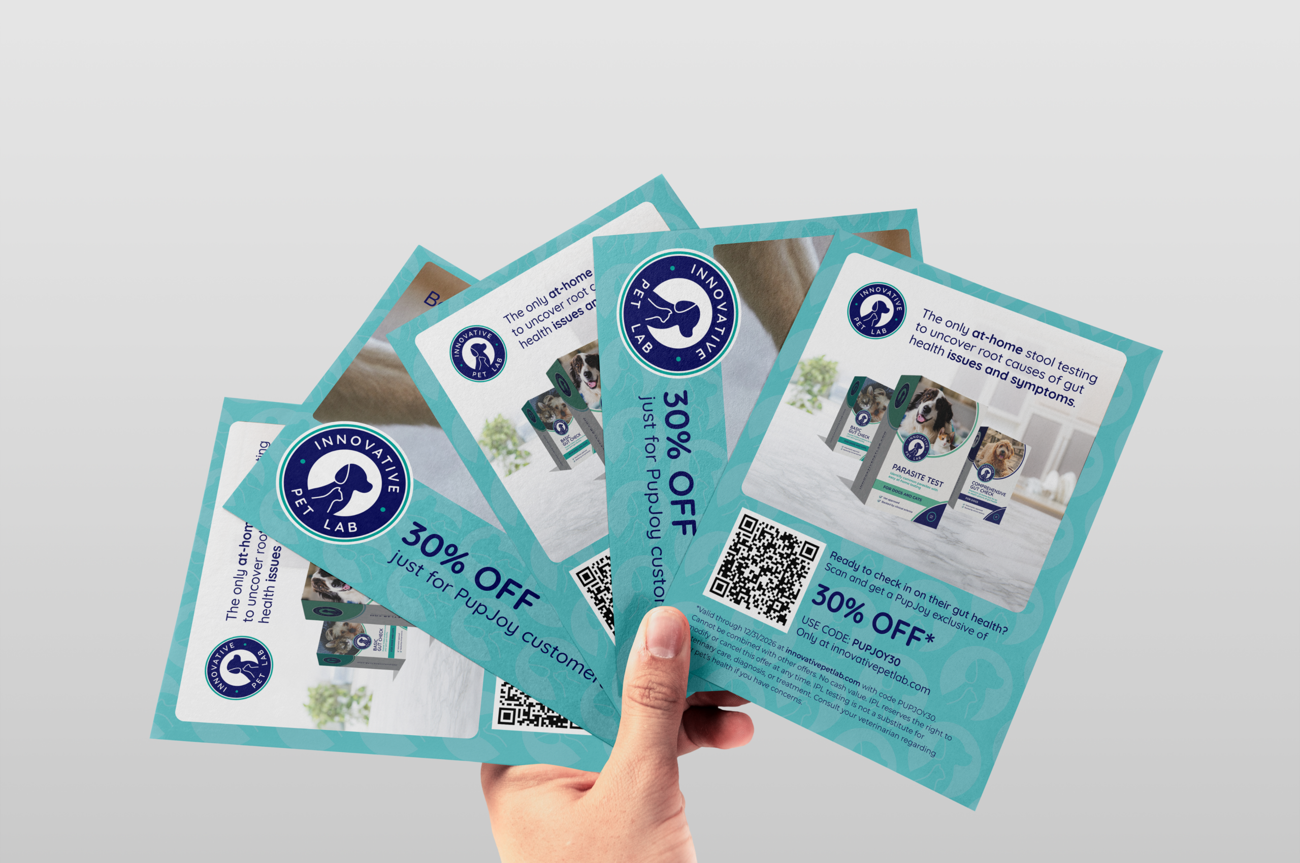 Hand holding Innovative Pet Lab discount coupon flyers